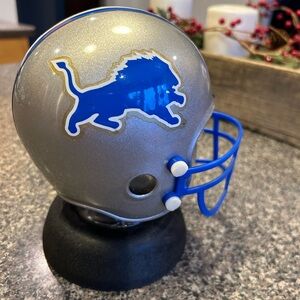 Detroit Lions plastic piggy coin bank.  Mini football helmet coin bank
